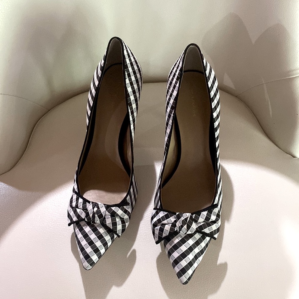 Black and white checkered heels with adorable bow detail at toe.